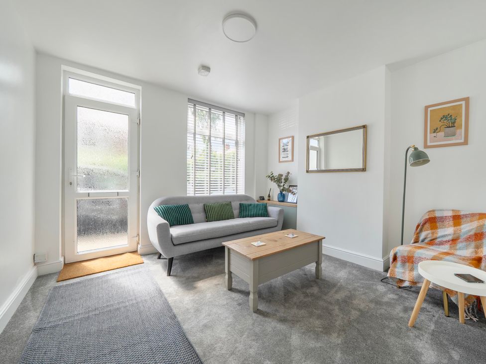 A living room with a sofa and coffee table at 140 Finchley Road Ipswich