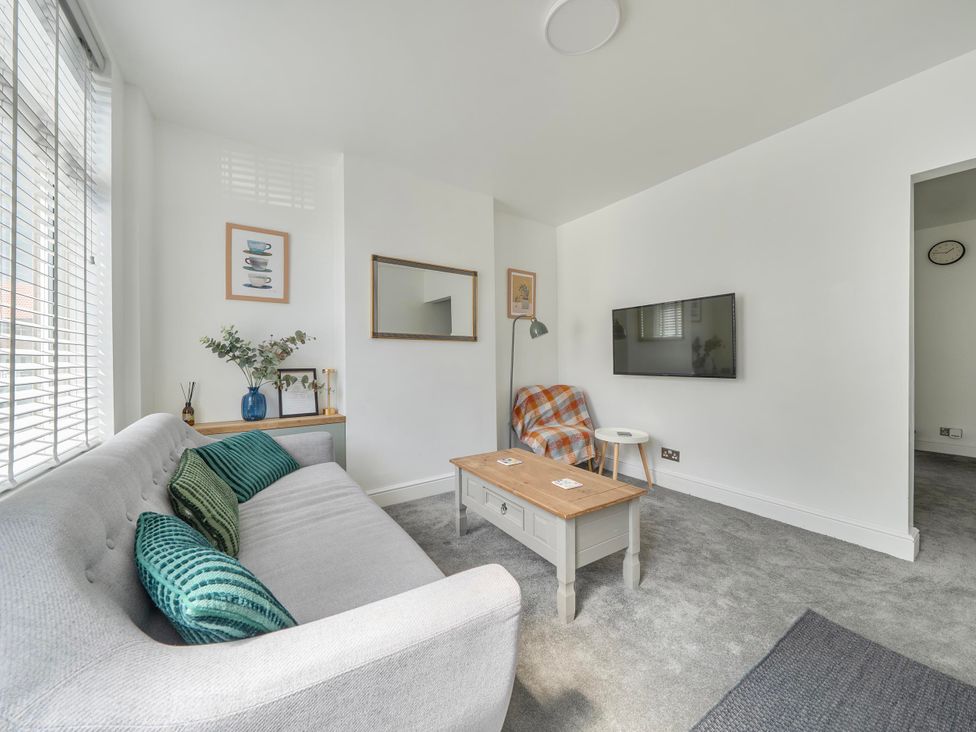 A living room with a coffee table and sofa at 140 Finchley Road in Ipswich