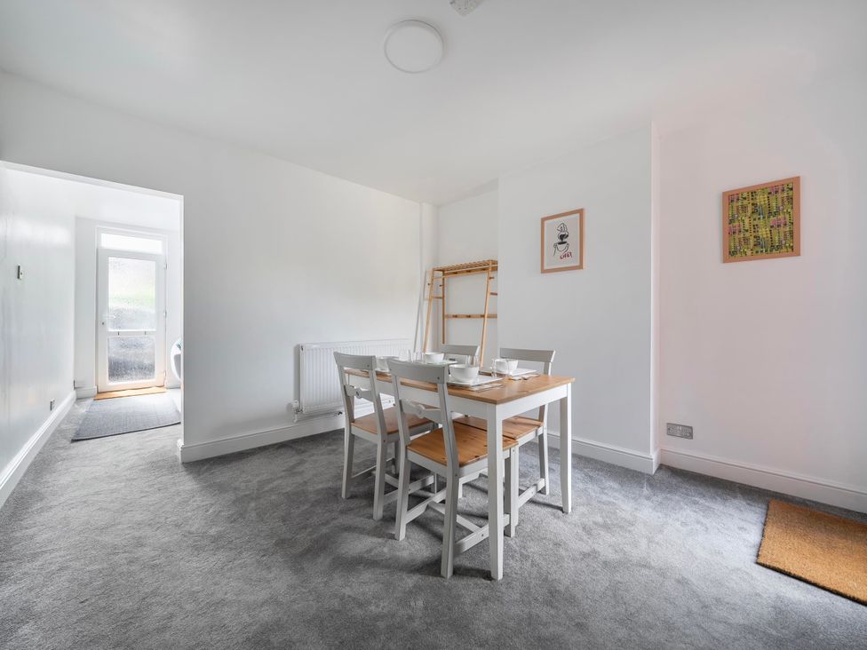 A dining room with a table and chairs at 140 Finchley Road in Ipswich
