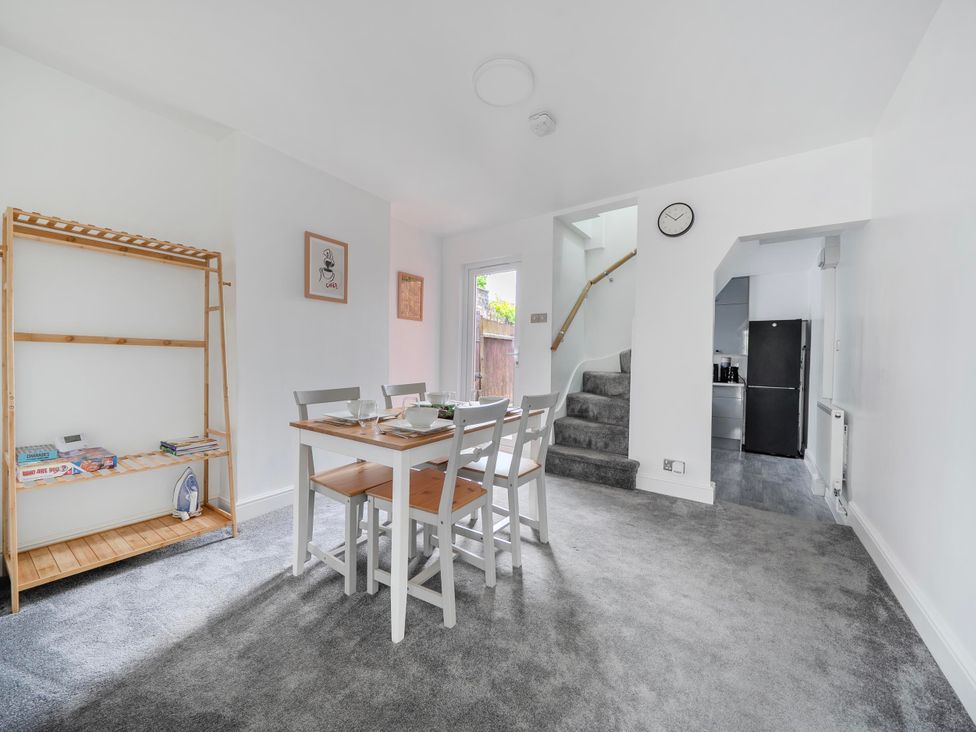 A dining area with a table and chairs at 140 Finchley Road Ipswich