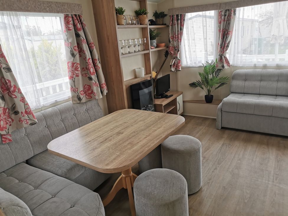 A living room with a table and couch at the property in an unspecified location