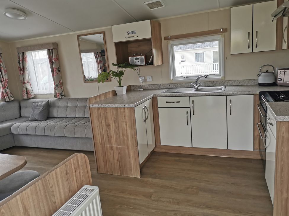 A kitchen with a sink and cabinets at 