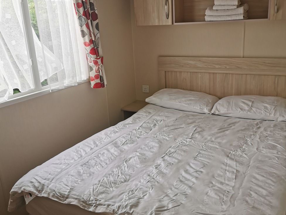 A bedroom with a bed and window at 