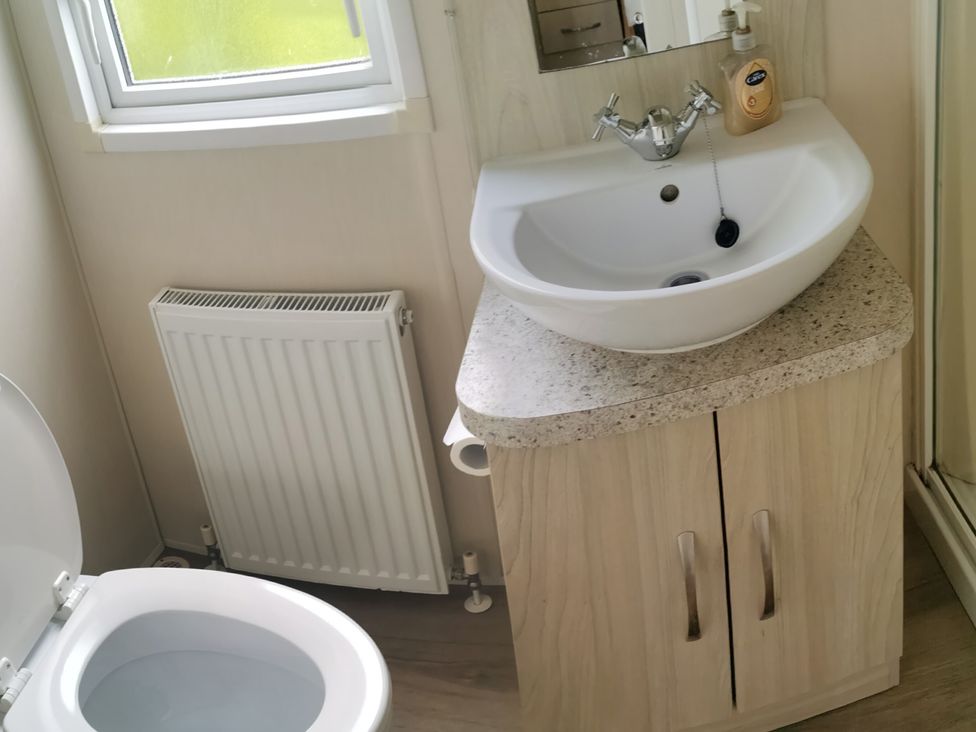 A bathroom with a sink and toilet at The Old Barn in Manchester