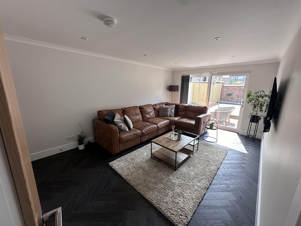 A living room with a sofa and coffee table at 22 Fraser Avenue