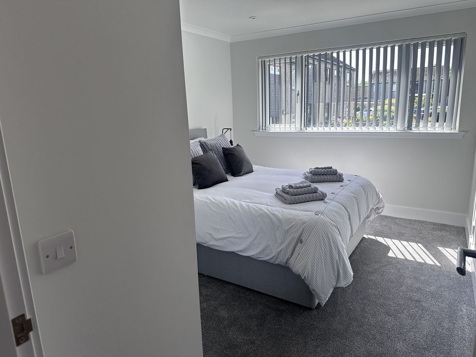 A bedroom with a bed and a window at 22 Fraser Avenue