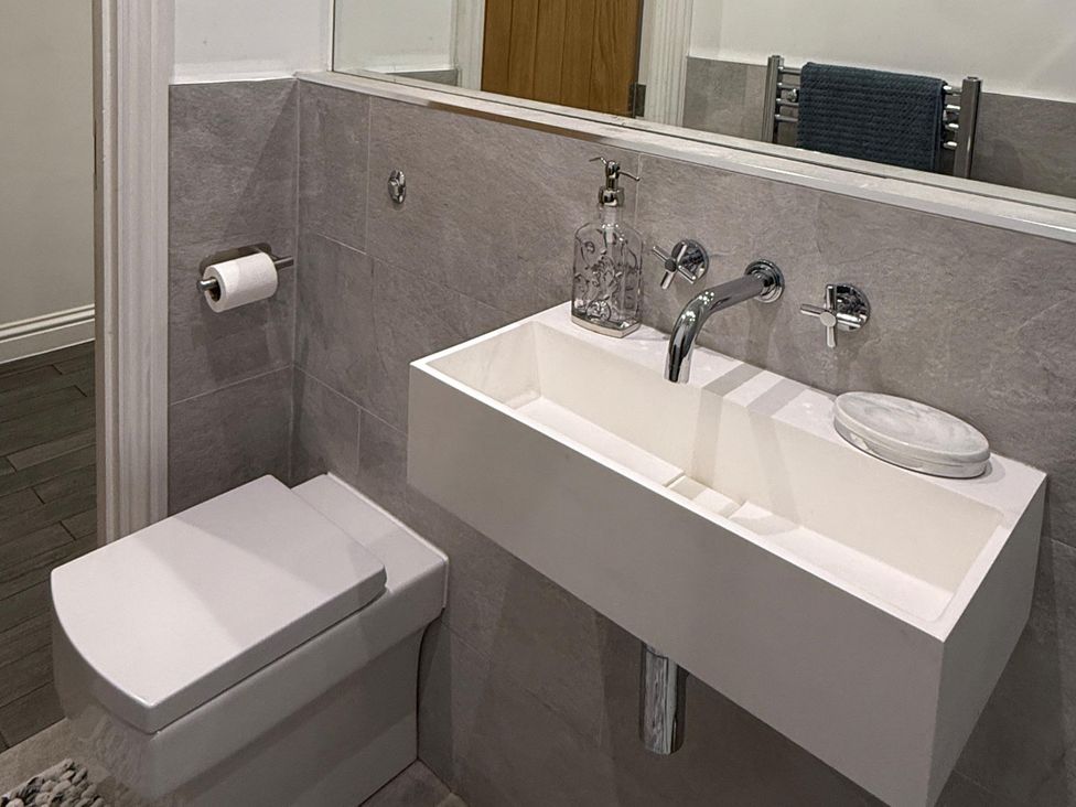 A bathroom with a toilet and a sink at Seaside Bliss in Brighton