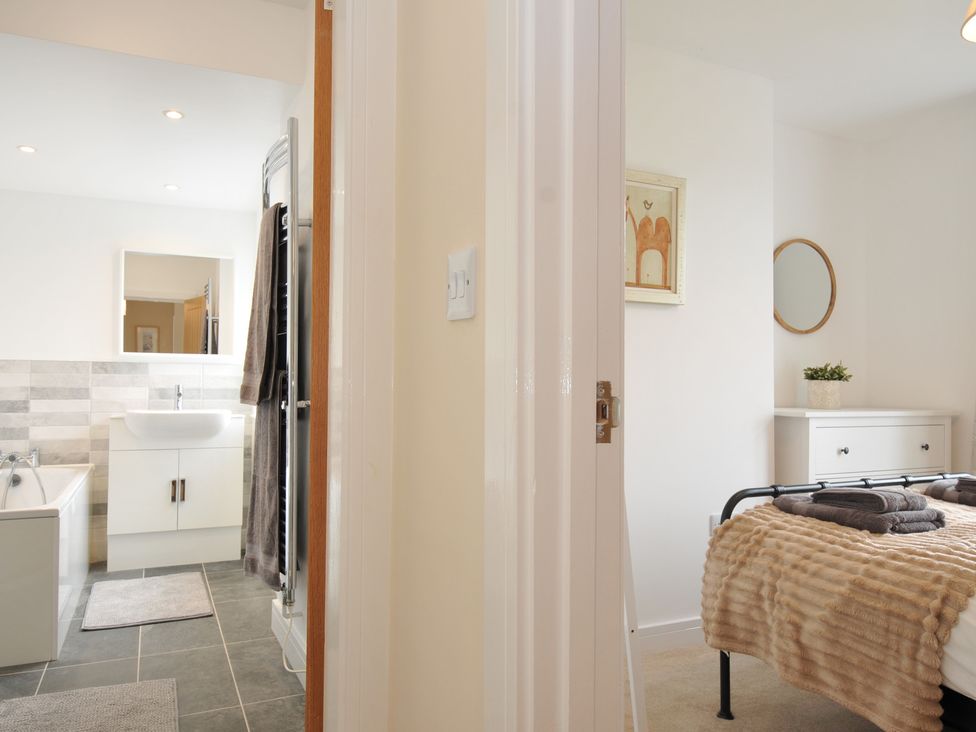 A bathroom and bedroom view at Barton House in Looe