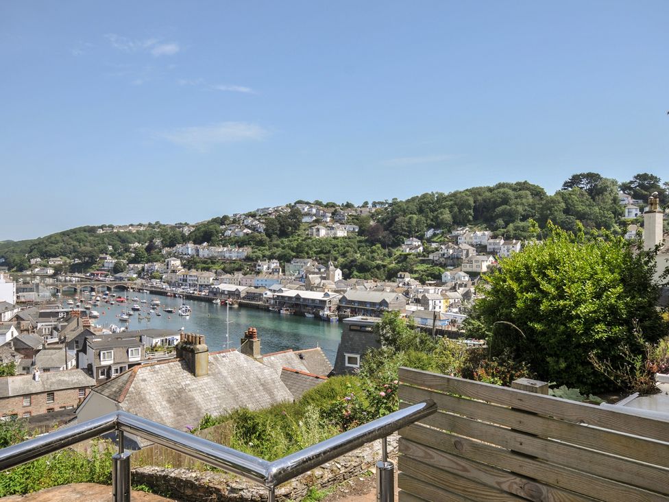 A view of a harbor with boats and houses at Barton House in Looe