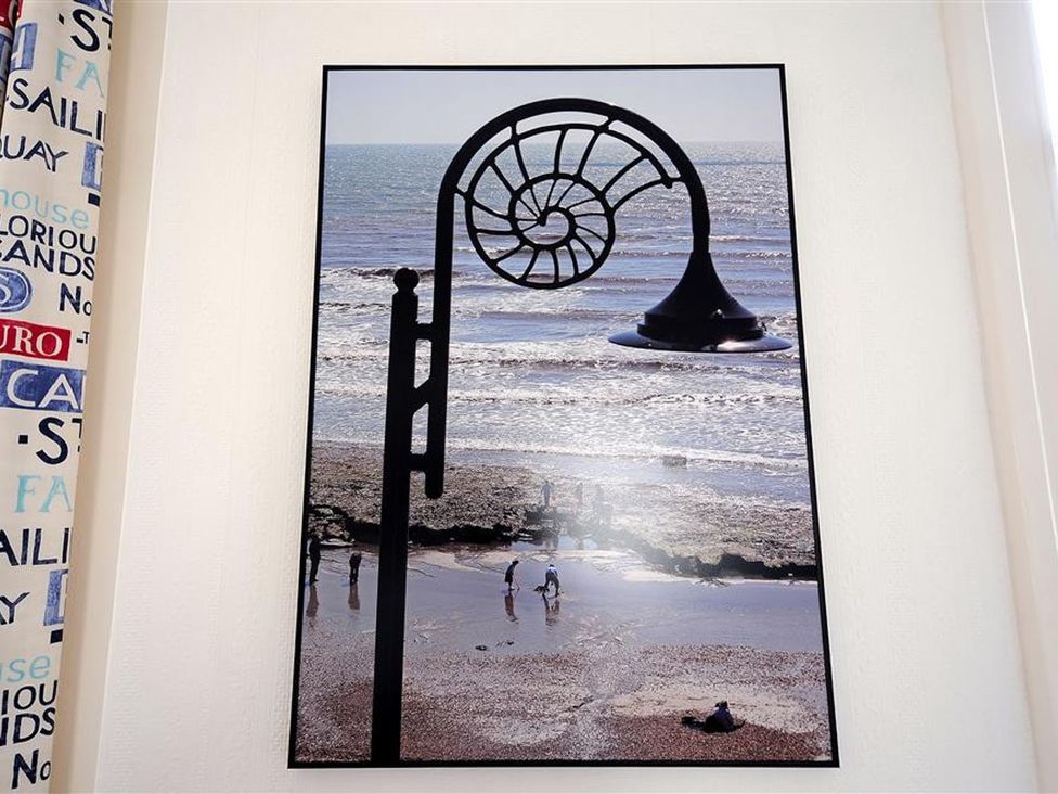 A photo of a beach scene with a snail shell design at 1 The Old Posthouse, Lyme Regis