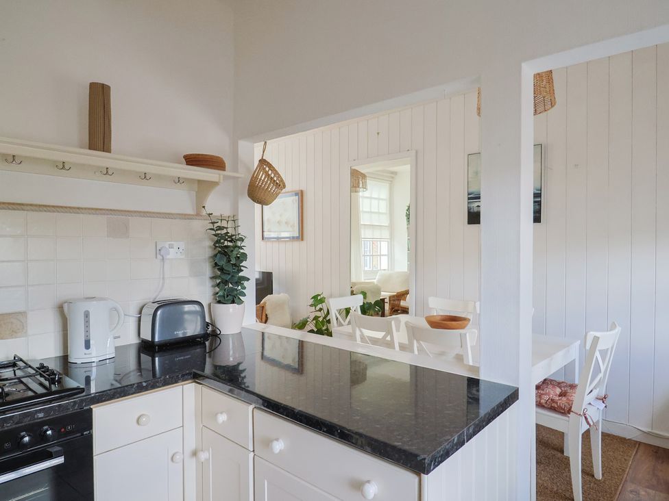 A kitchen with a toaster and kettle at 1 The Old Posthouse in Lyme Regis
