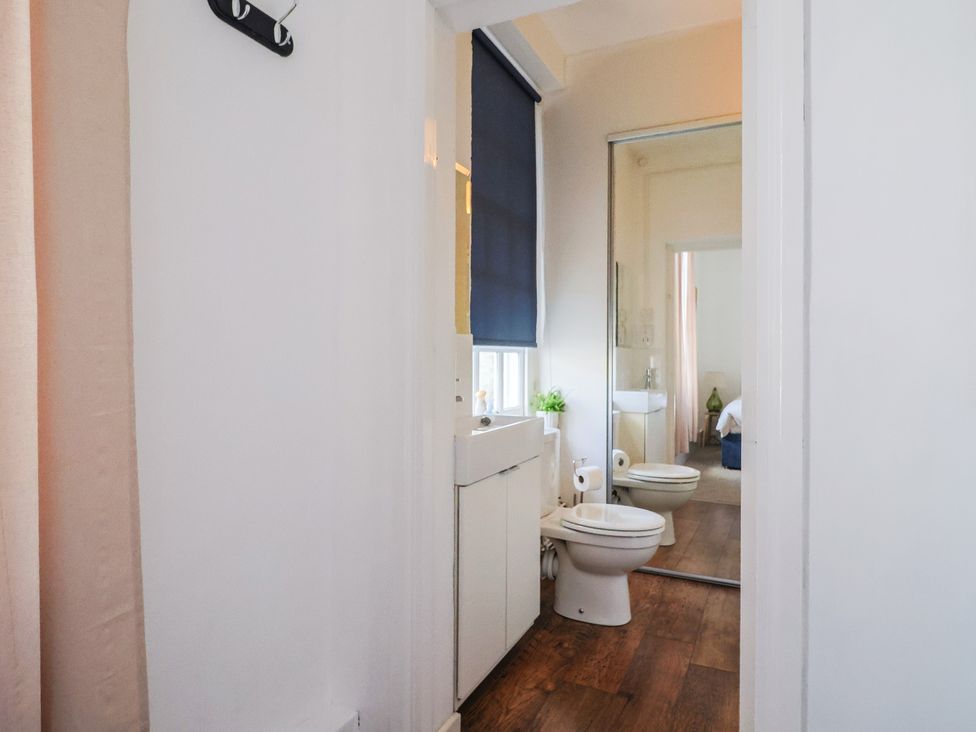 A bathroom with a toilet and sink at 1 The Old Posthouse in Lyme Regis