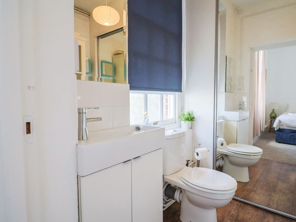 A bathroom with a sink and toilet at 1 The Old Posthouse in Lyme Regis