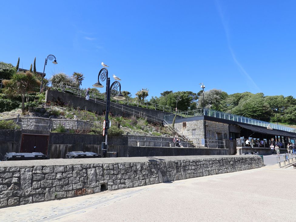 A pathway with stairs and plants in a coastal area at 1 The Old Posthouse in Lyme Regis