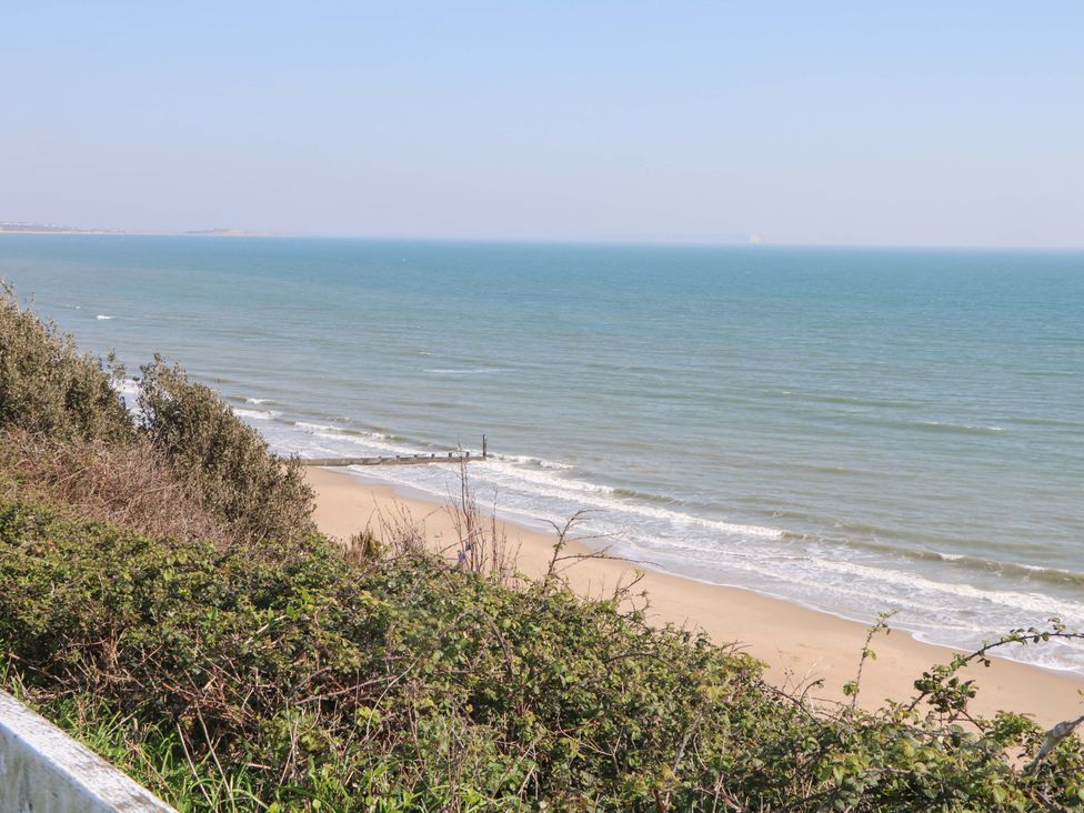 A view of the ocean and beach with waves at The Beach House in 