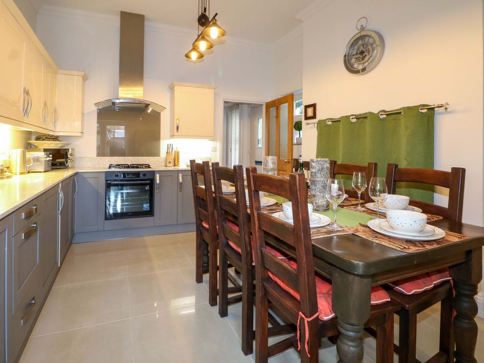 A kitchen with dining table set at The Beach House in Bournemouth