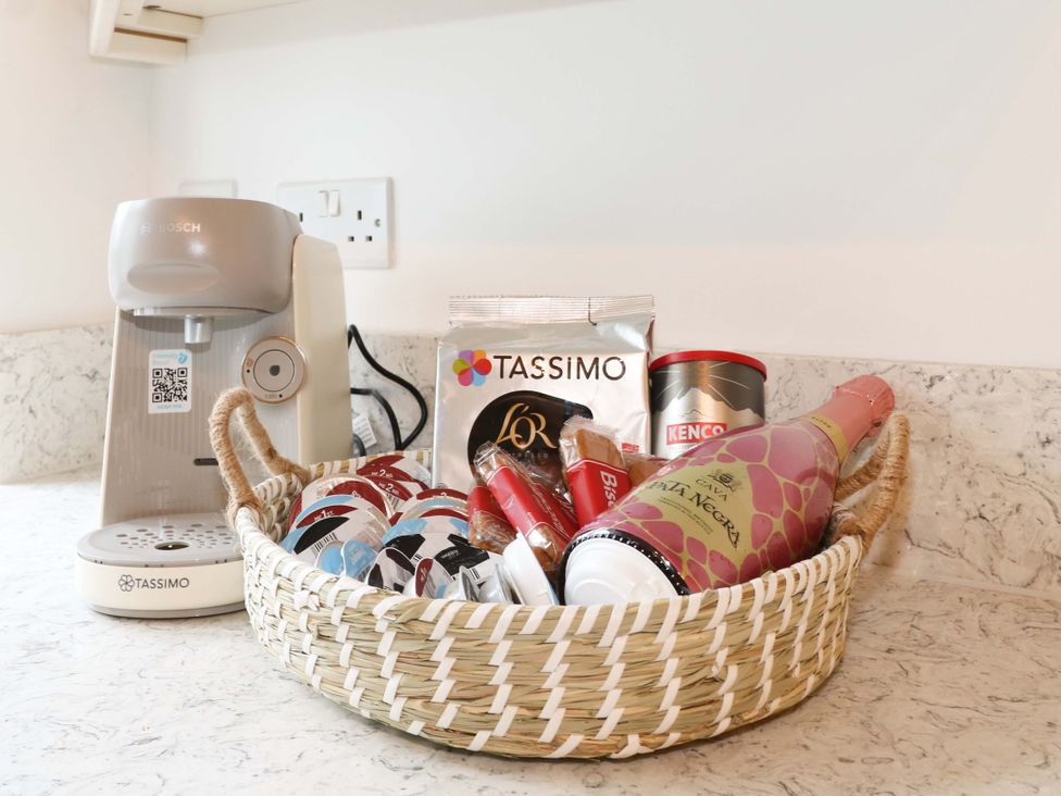 A coffee machine with coffee pods in a basket at The Beach House in Bournemouth
