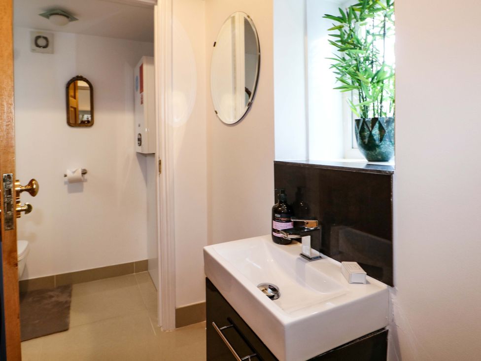 A bathroom with a sink and toilet at The Beach House in Bournemouth