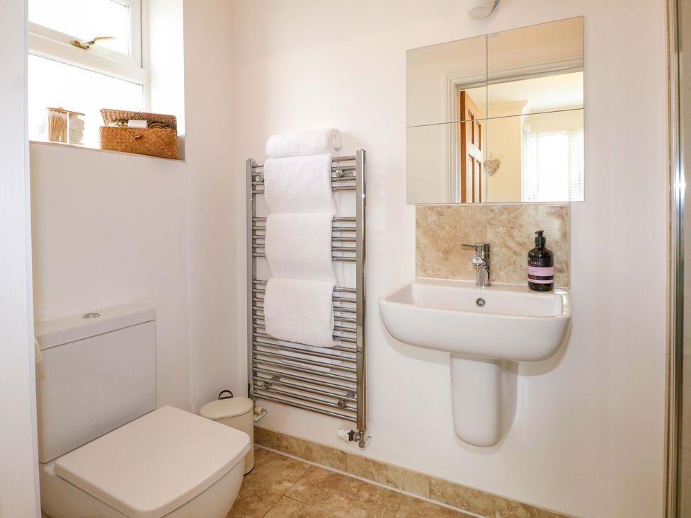 A bathroom with a sink and toilet at The Beach House in Bournemouth
