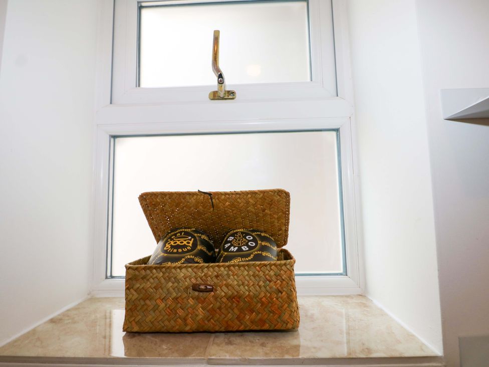 A basket with items inside on a windowsill at The Beach House in Bournemouth