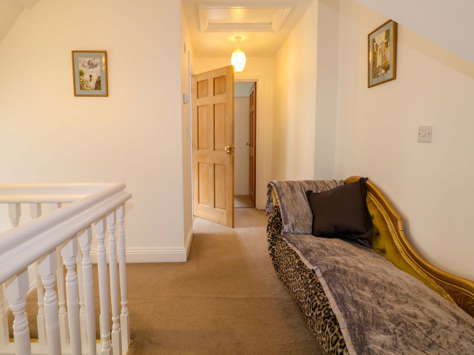 A hallway with a sofa and door at The Beach House in Bournemouth