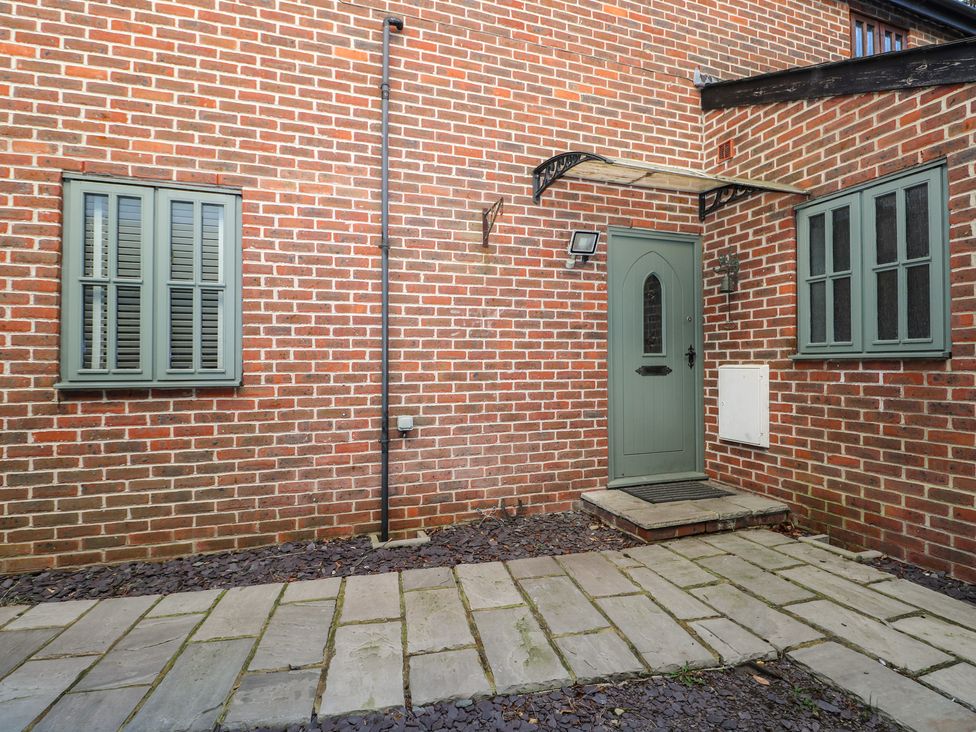 A front entrance with a door and windows at Tiffanys Coach House in Bournemouth