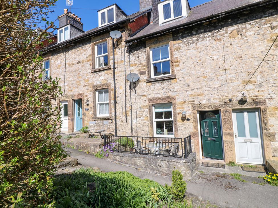 A stone house with windows and doors at 7 Catcliffe Cottages Bakewell