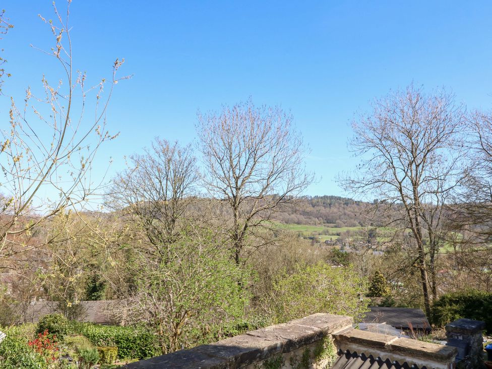 A view of trees and hills from a garden at 7 Catcliffe Cottages Bakewell