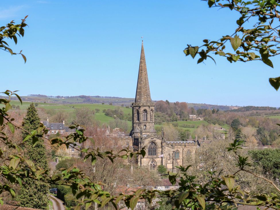 A church with a steeple in a landscape at 7 Catcliffe Cottages Bakewell