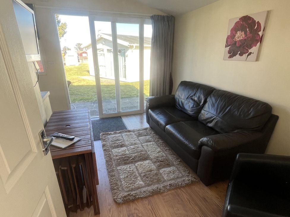 A living room with a sofa and coffee table at Embury