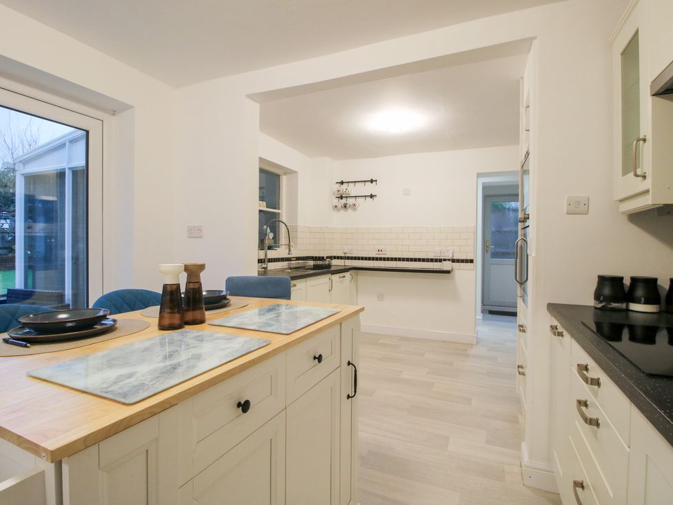 A kitchen with table and chairs at 12 Beaufort Close Telford