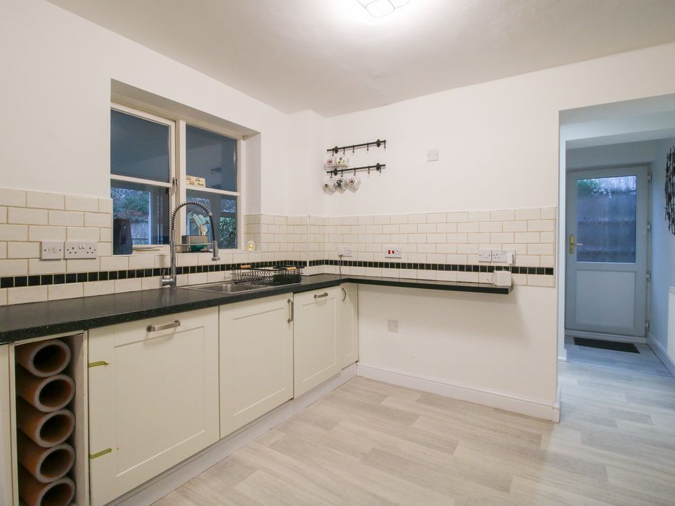 A kitchen with a sink and cabinets at 12 Beaufort Close in Telford