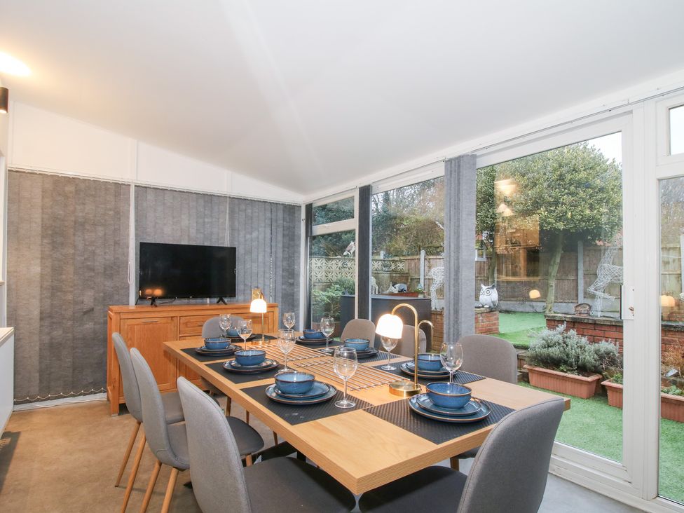 A dining area with a table and chairs at 12 Beaufort Close in Telford