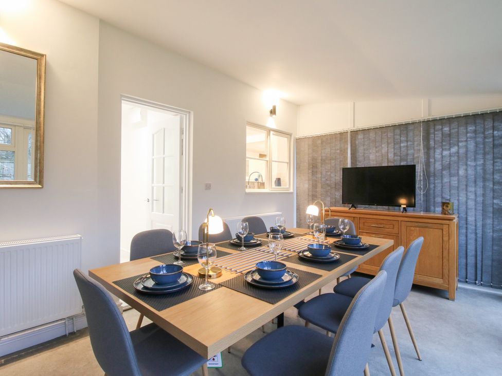 A dining room with a table and chairs at 12 Beaufort Close Telford