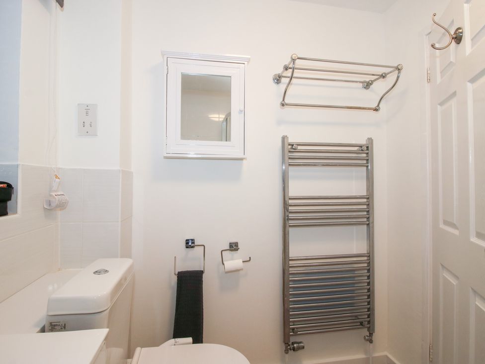 A bathroom with a toilet and a towel rail at 12 Beaufort Close Telford