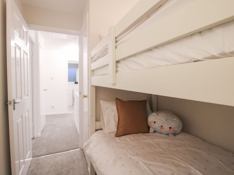 A bedroom with a bunk bed and stuffed animal at 12 Beaufort Close in Telford