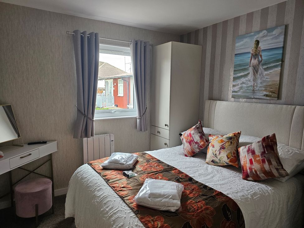 A bedroom with a bed and window at 38A in Bridlington
