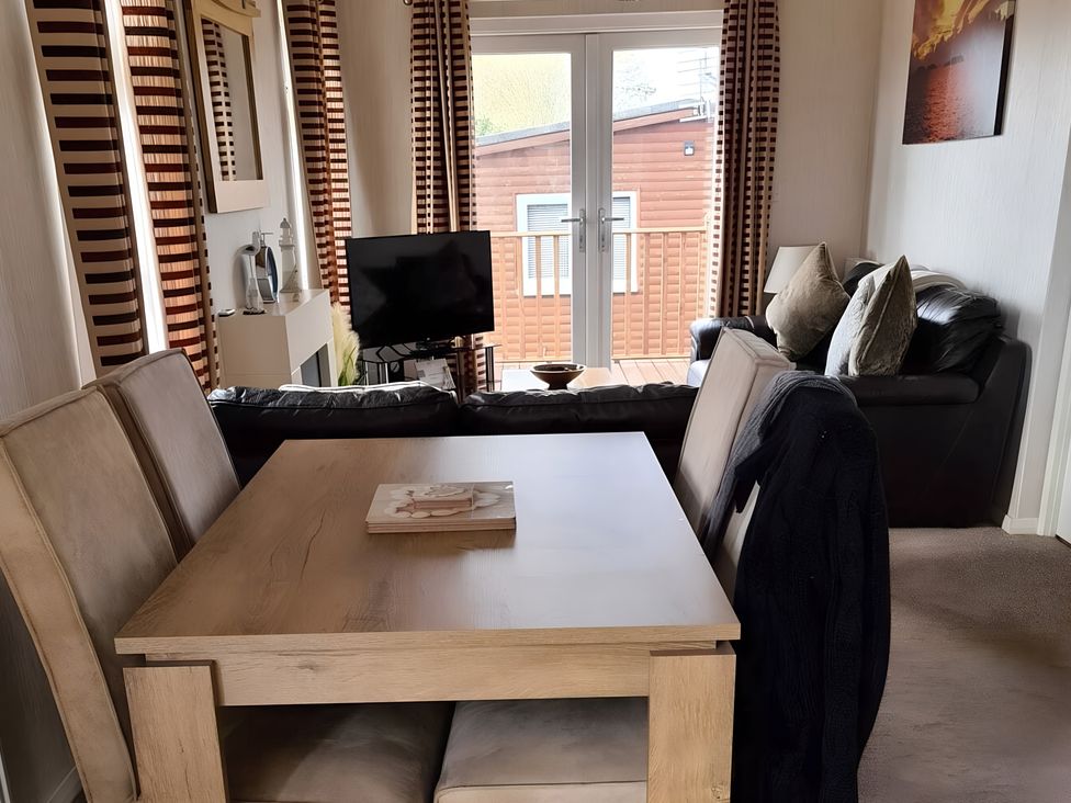 A living room with a table and sofa at 311 Bridlington