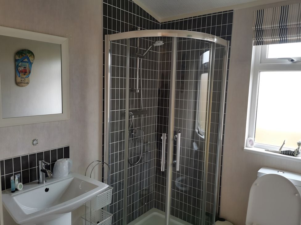 A bathroom with a shower and sink at 311 in Bridlington