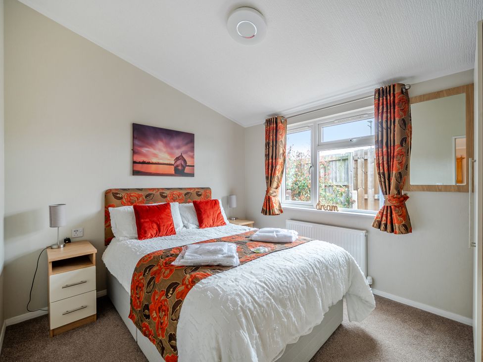 A bedroom with a bed and window at 311 Bridlington
