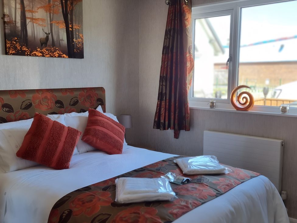 A bedroom with a bed and window at 50 Bridlington