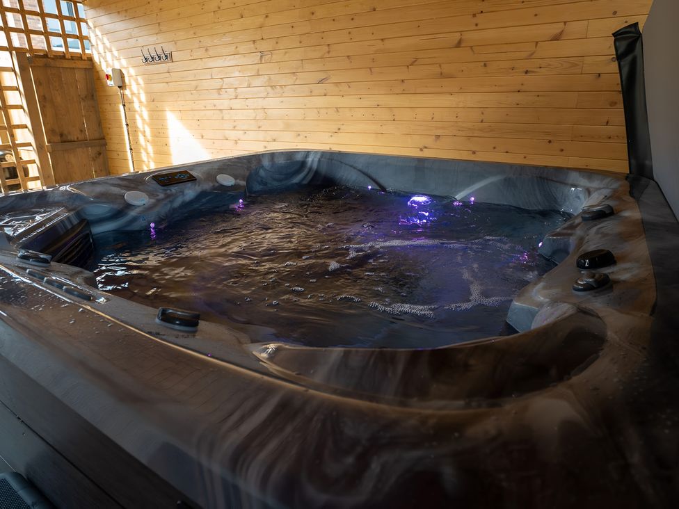 A hot tub with wooden walls at The Galloway in Morpeth