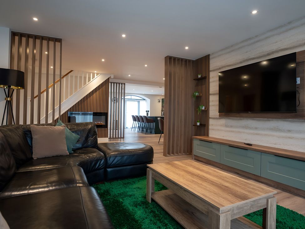 A living room with a sofa and coffee table at The Galloway in Morpeth