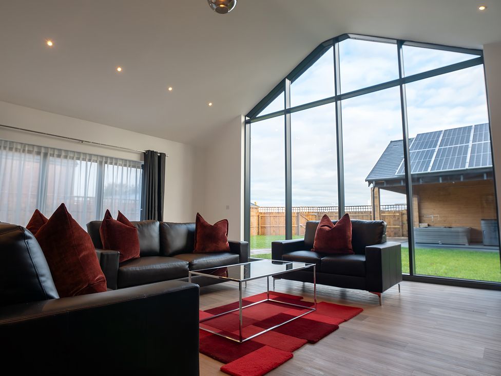A living room with a sofa and coffee table at The Shearling in Morpeth