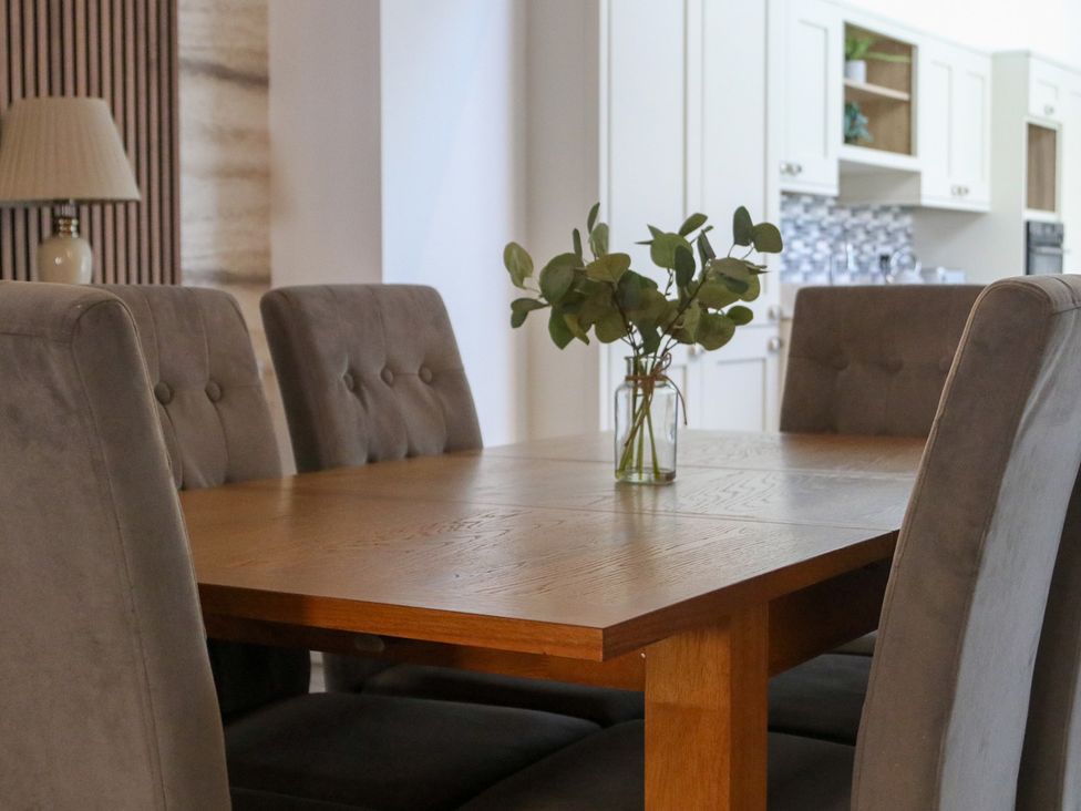 A dining room with a table and chairs at The Newland in Morpeth