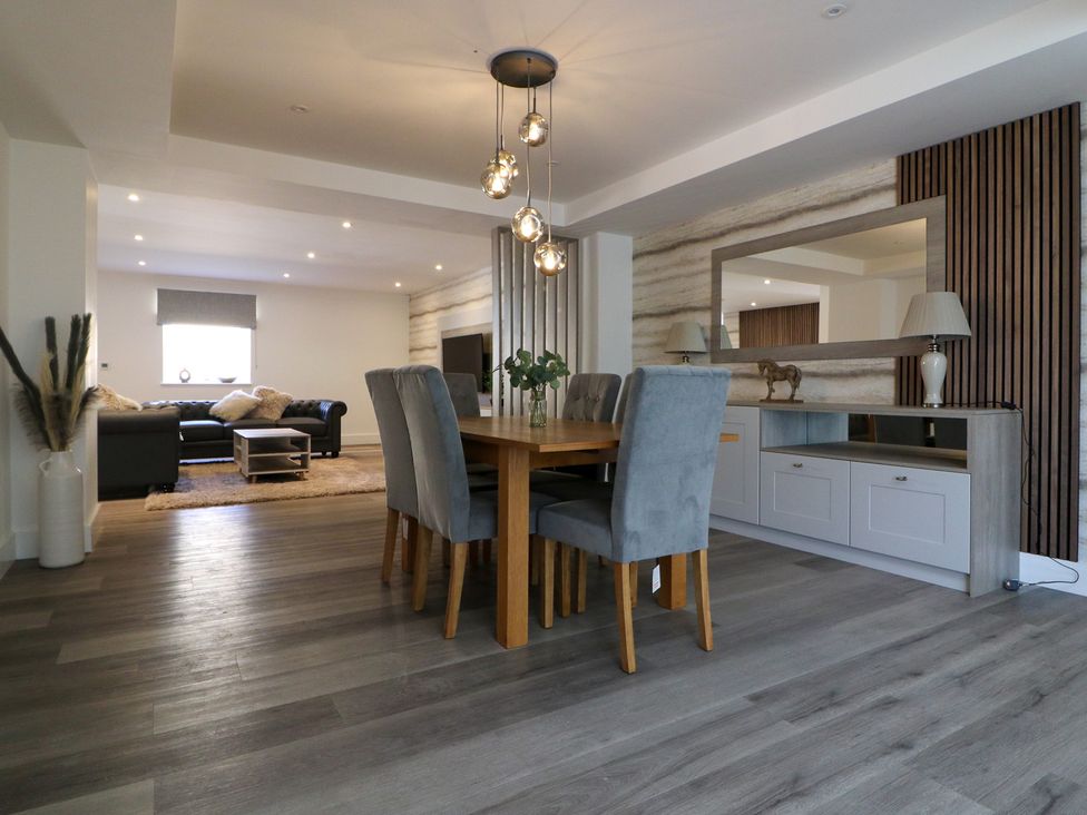 A dining room with a table and chairs at The Newland in Morpeth