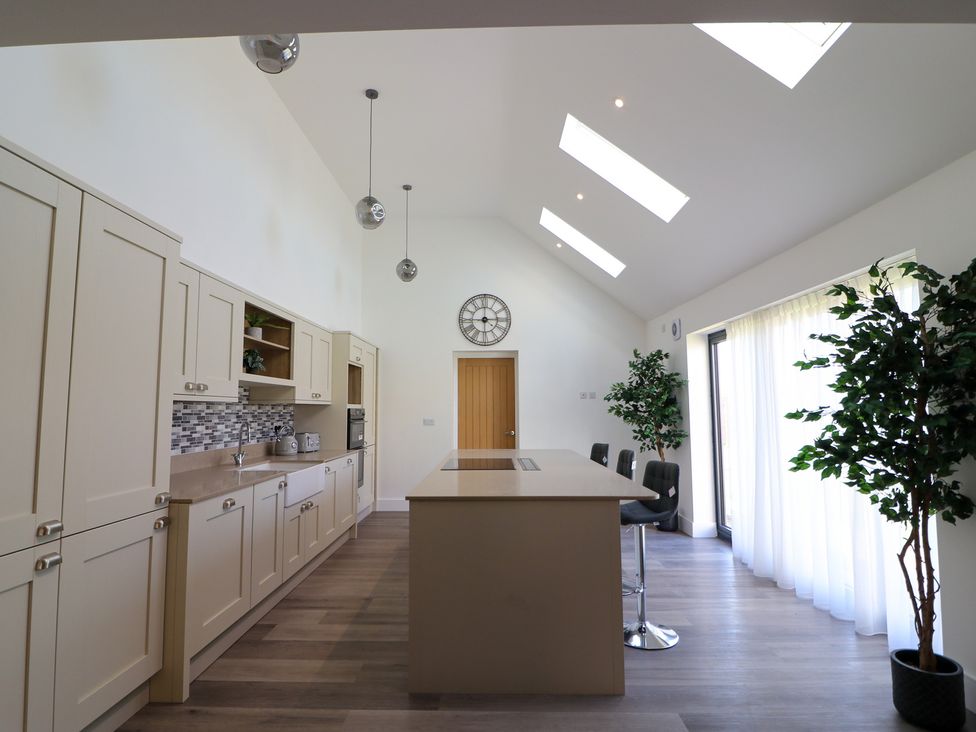 A kitchen with cabinets and a countertop at The Newland in Morpeth