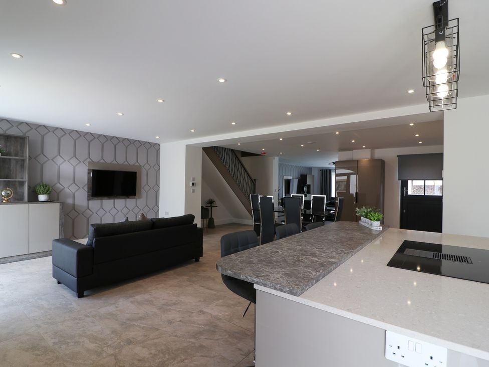 A living room with a sofa and television at The Gavel in Morpeth