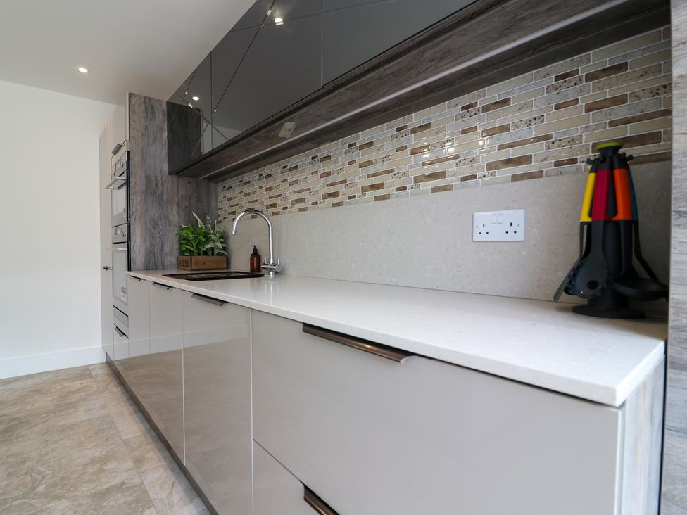 A kitchen with a sink and cabinet at The Gavel in Morpeth
