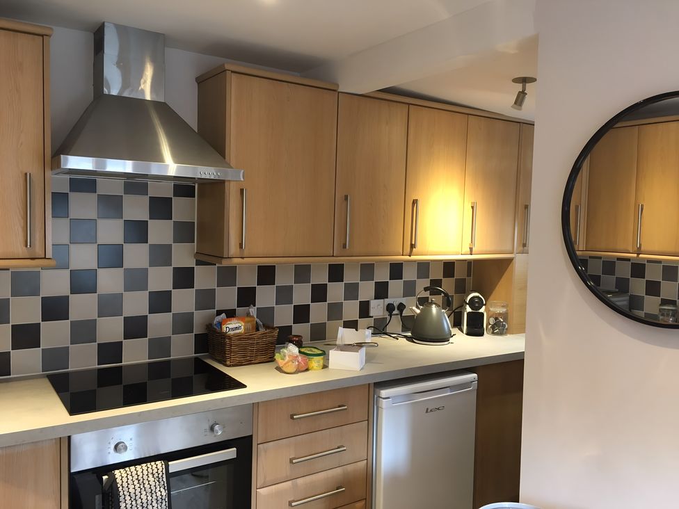 A kitchen with cabinets and appliances at 29 Front Street, Market Rasen